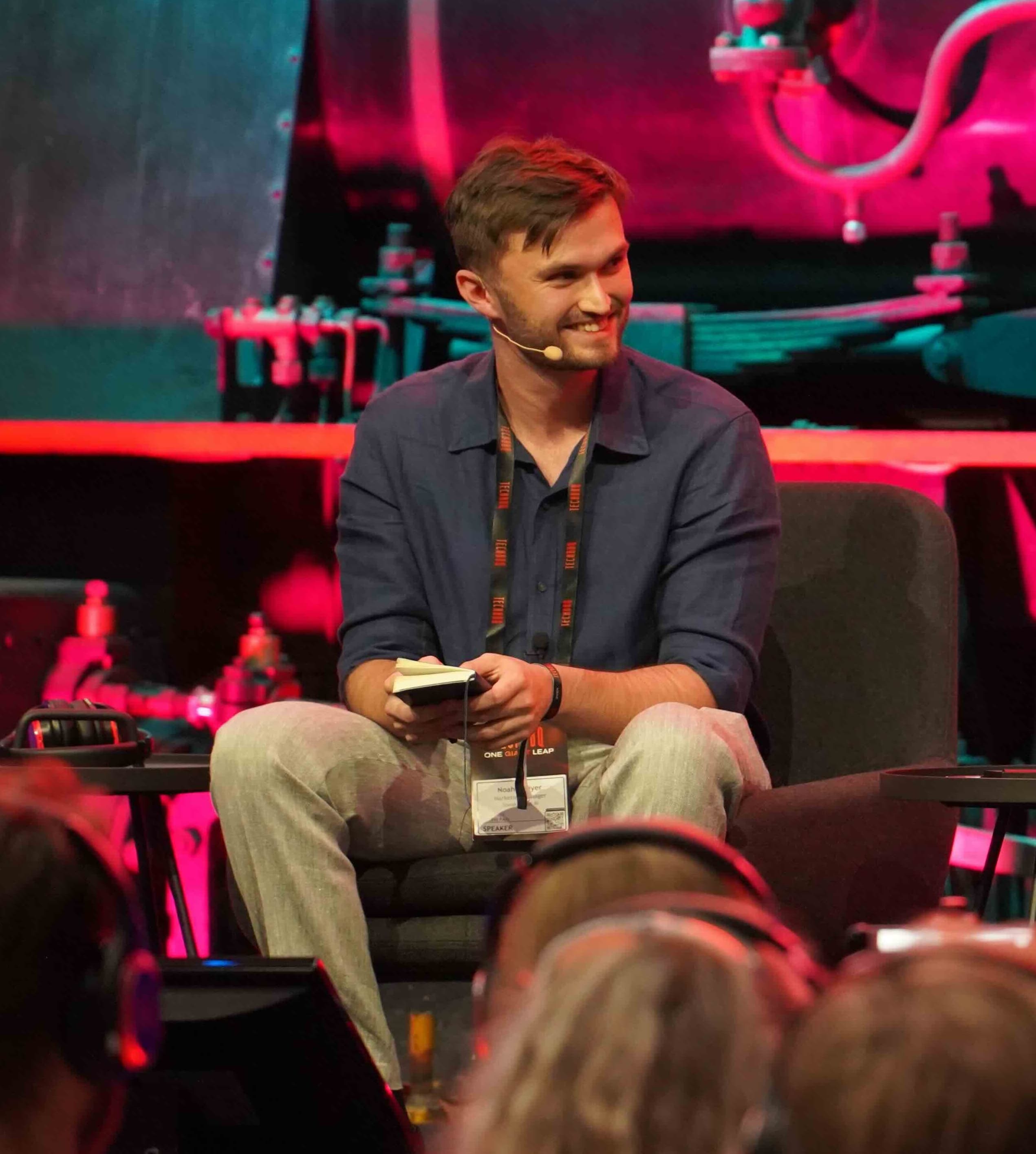 Noah Cheyer, founder of Silicon Valley Speakers, speaking on stage